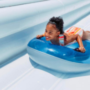 girl on water slide with tube