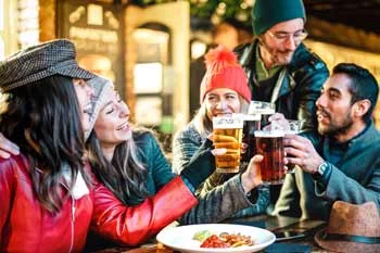 group of friends drinking beer at bartop